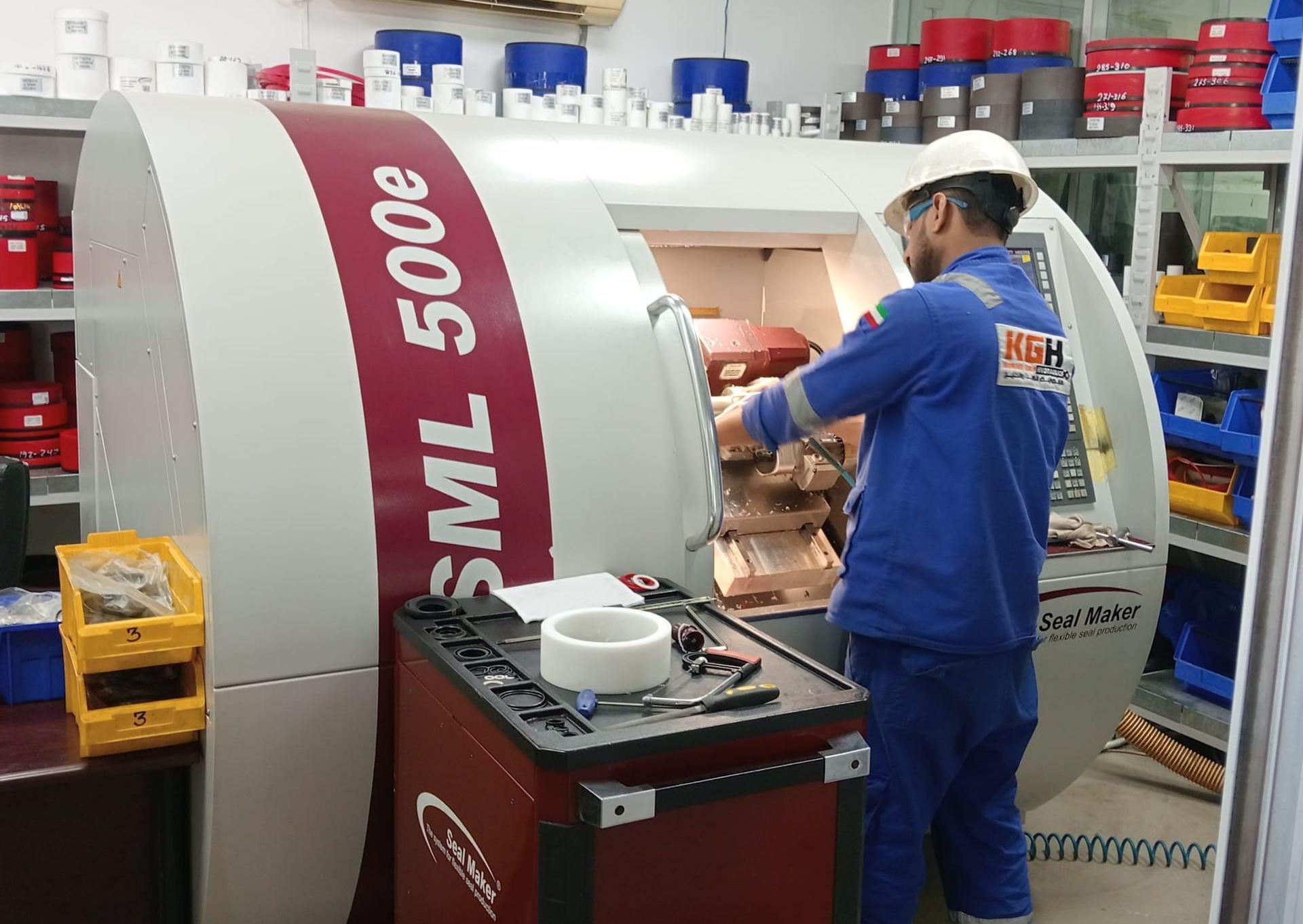 Person fabricating seals CNC machining